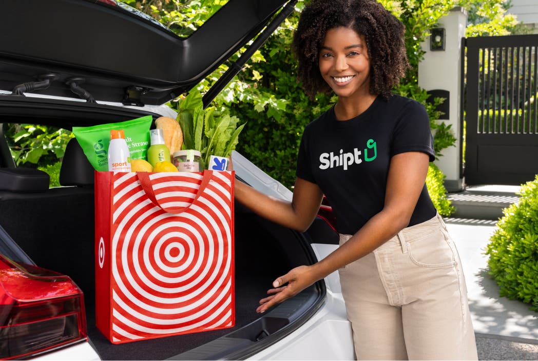 Shopper putting Target back in car
