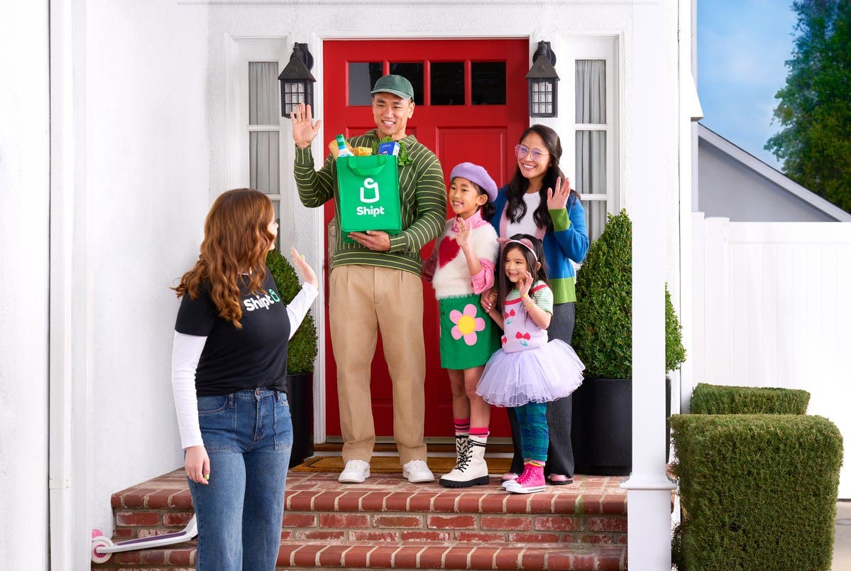 shopper dropping off delivery to family at porch step