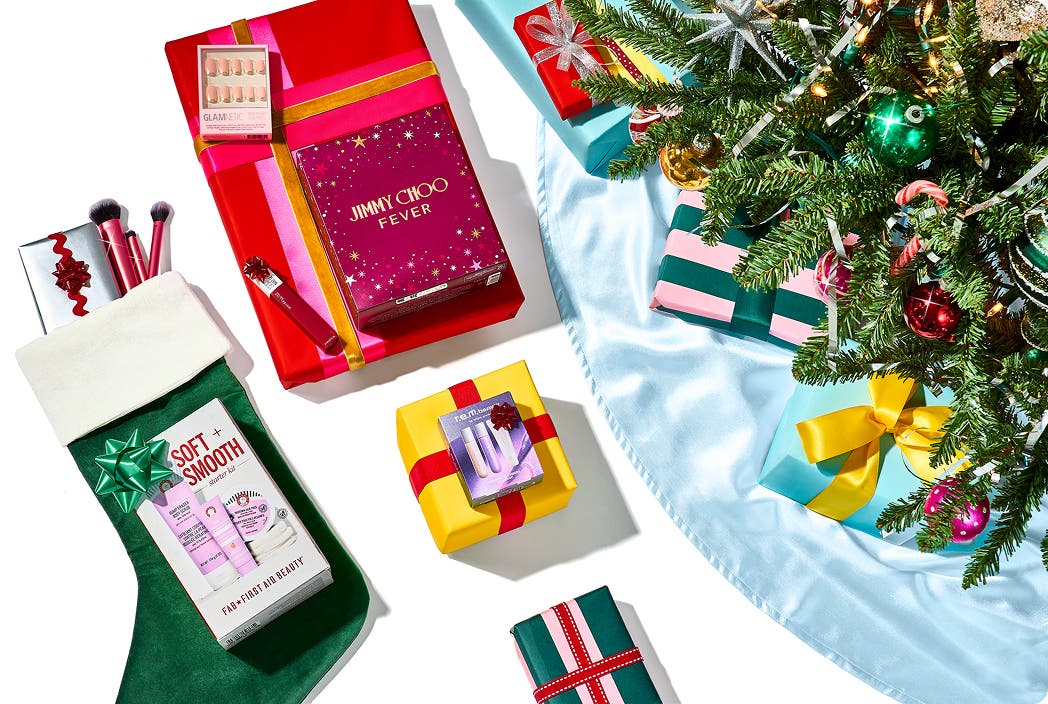 present and a stocking under a Christmas tree