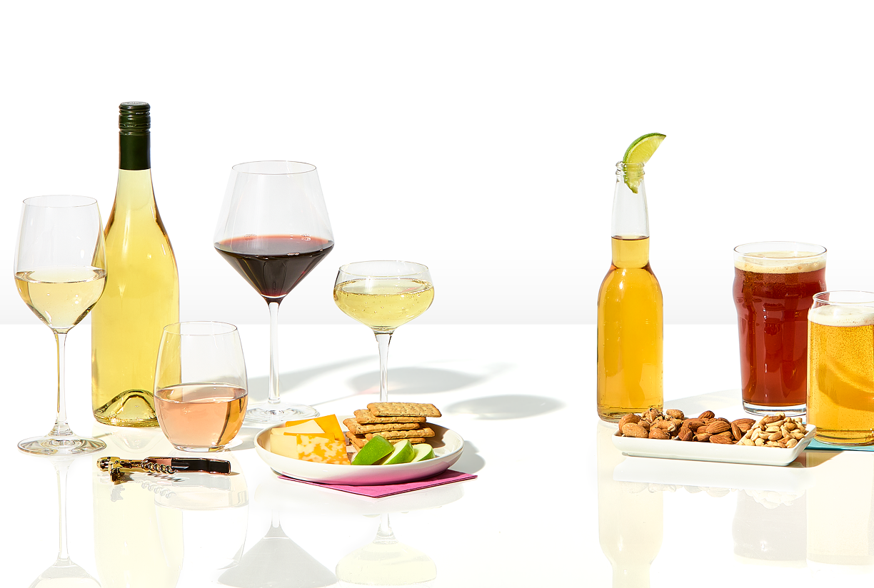 Beer, champagne, wine, and mixed drinks against a white background