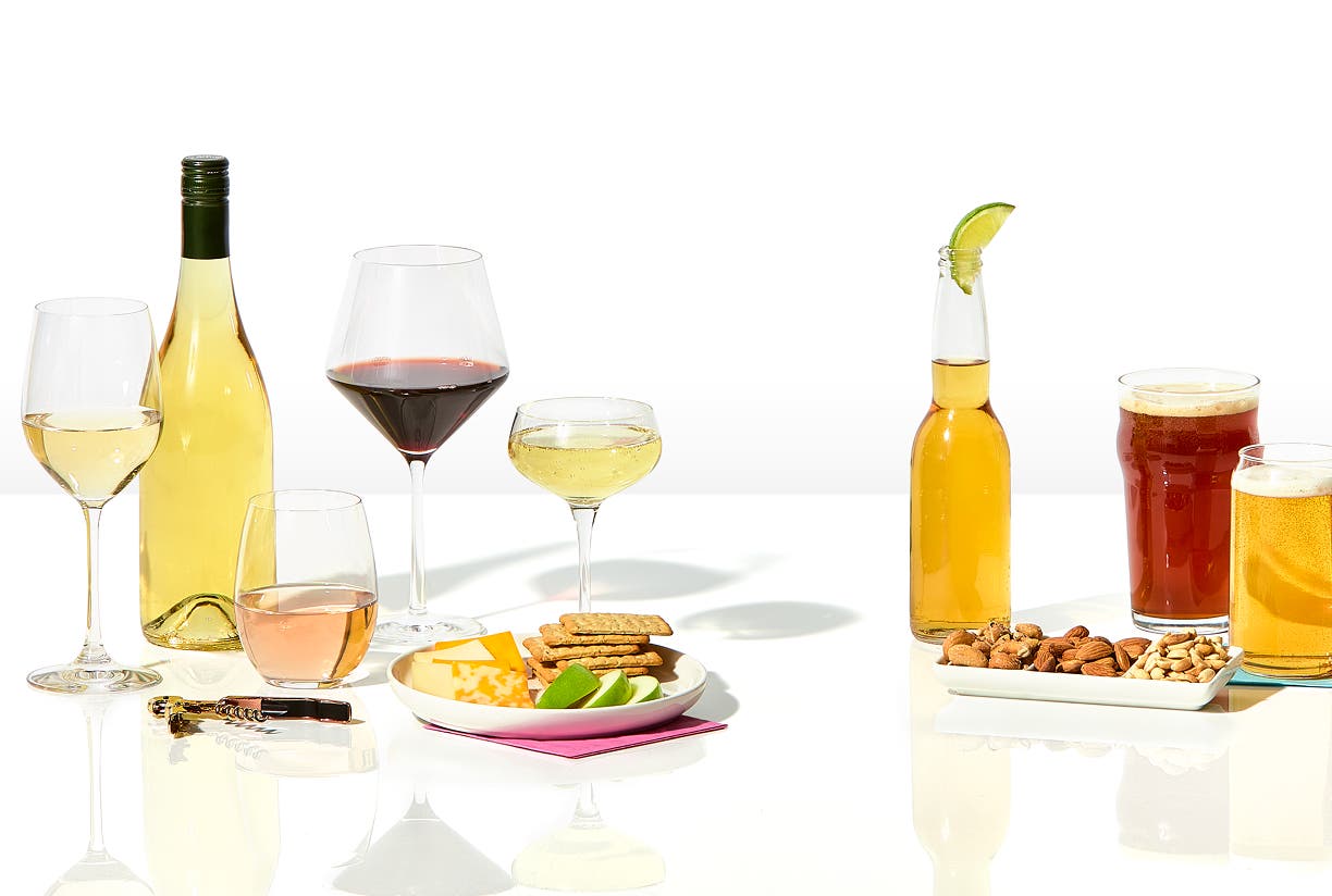 Beer, champagne, wine, and mixed drinks against a white background