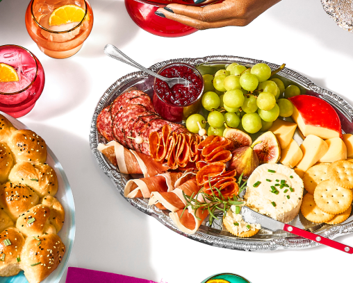 A table filled with platters of casual party food