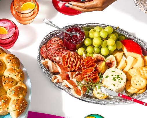 A table filled with platters of casual party food