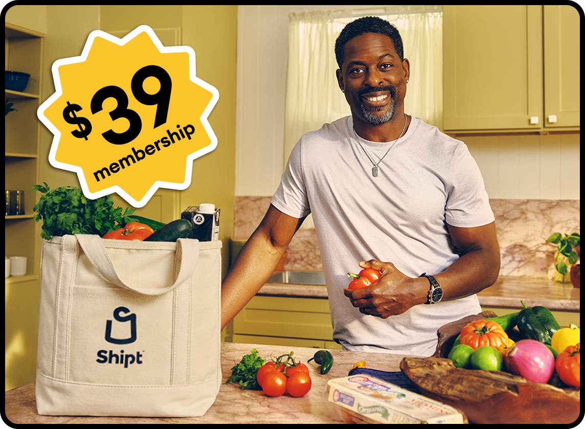 Sterling K Brown with Bag and Shipt Summer of Savings logo