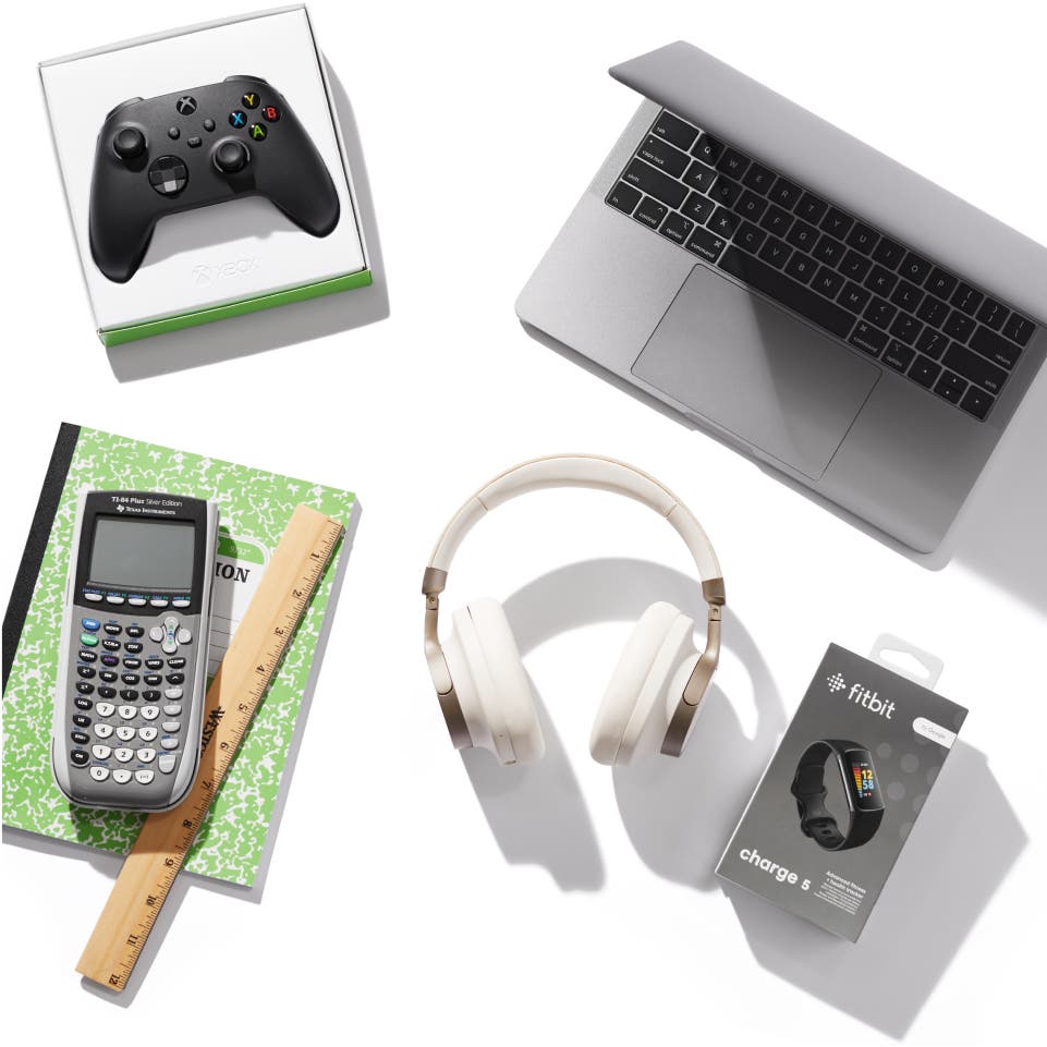 A laptop, headphones, FitBit, Xbox controlled, and graphing calculator on a white background