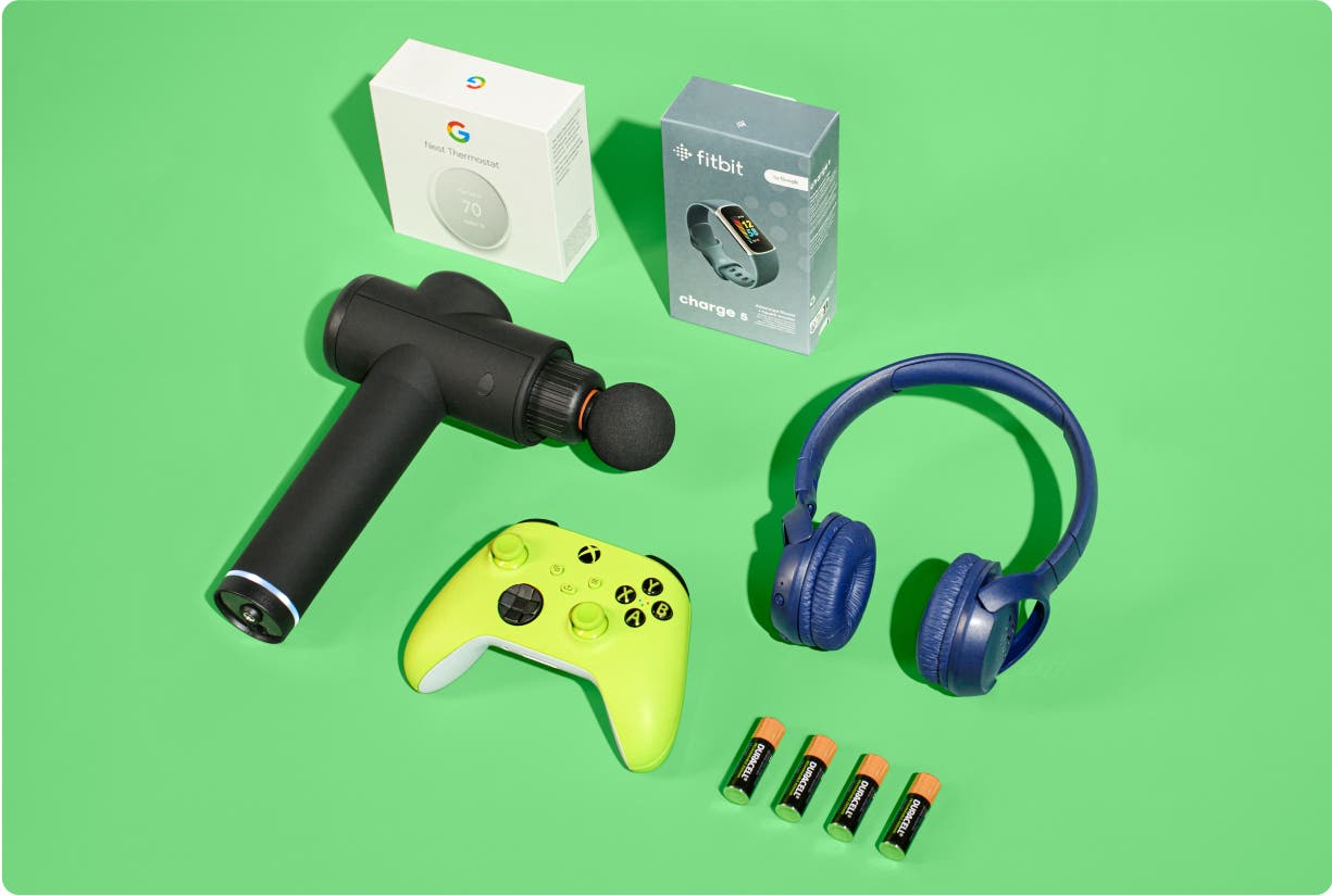 Electronic devices (Xbox controlled, TheraGun, headphones, batteries, FitBit, and a Nest Thermostat) on a green background