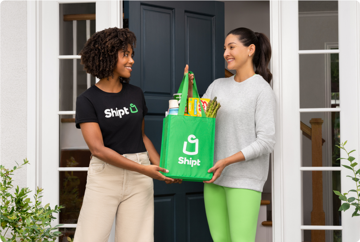 Shopper handing member groceries