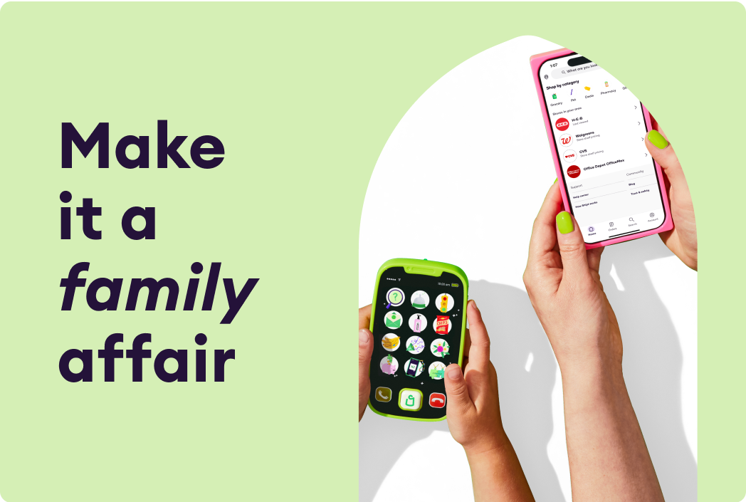 Close up of child and parent holding mobile devices