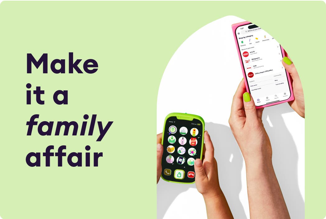 Close up of child and parent holding mobile devices