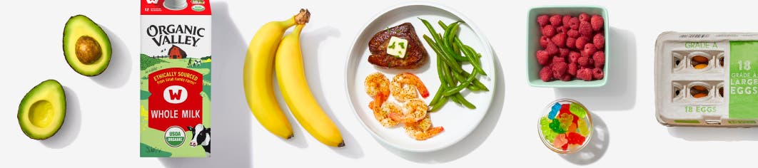 avocado, milk, banana, plated steak, shrimp, and green beans, berries, gummy worms, and eggs