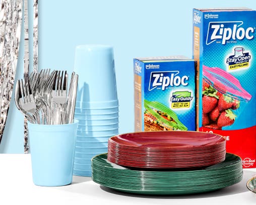 Party supplies including plates, utensils, and storage bags