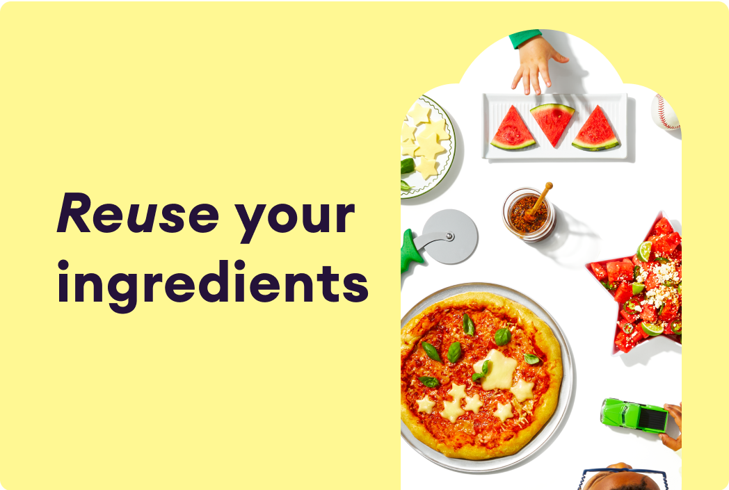 Tablespead of food options including pizza, watermelon slices, and fruit salad