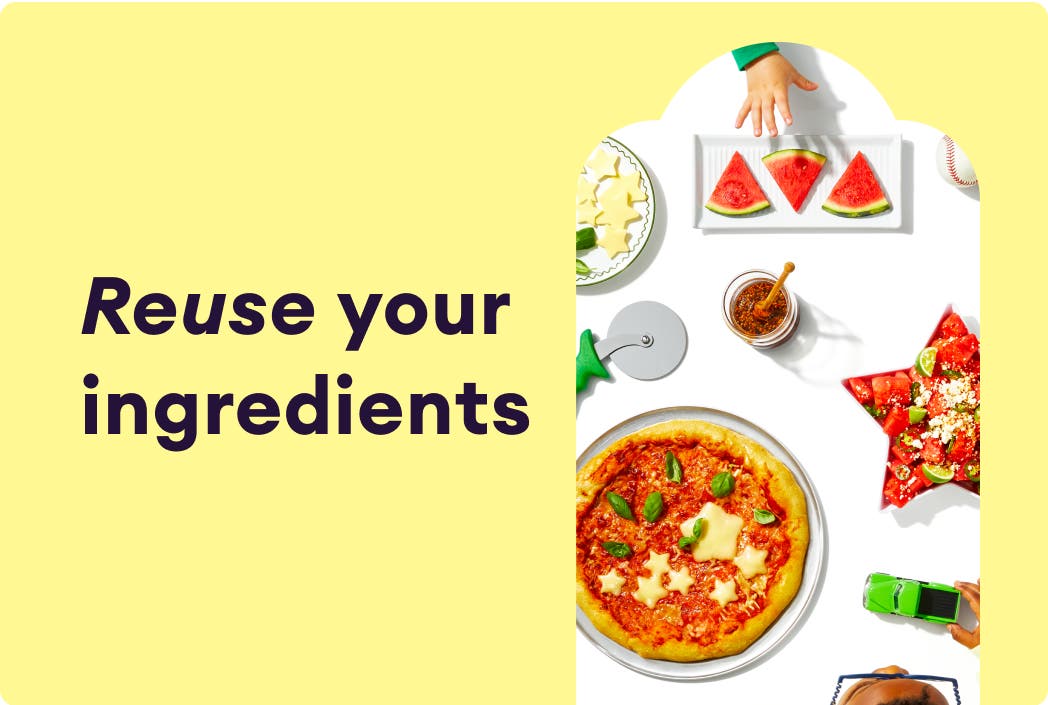 Tablespead of food options including pizza, watermelon slices, and fruit salad