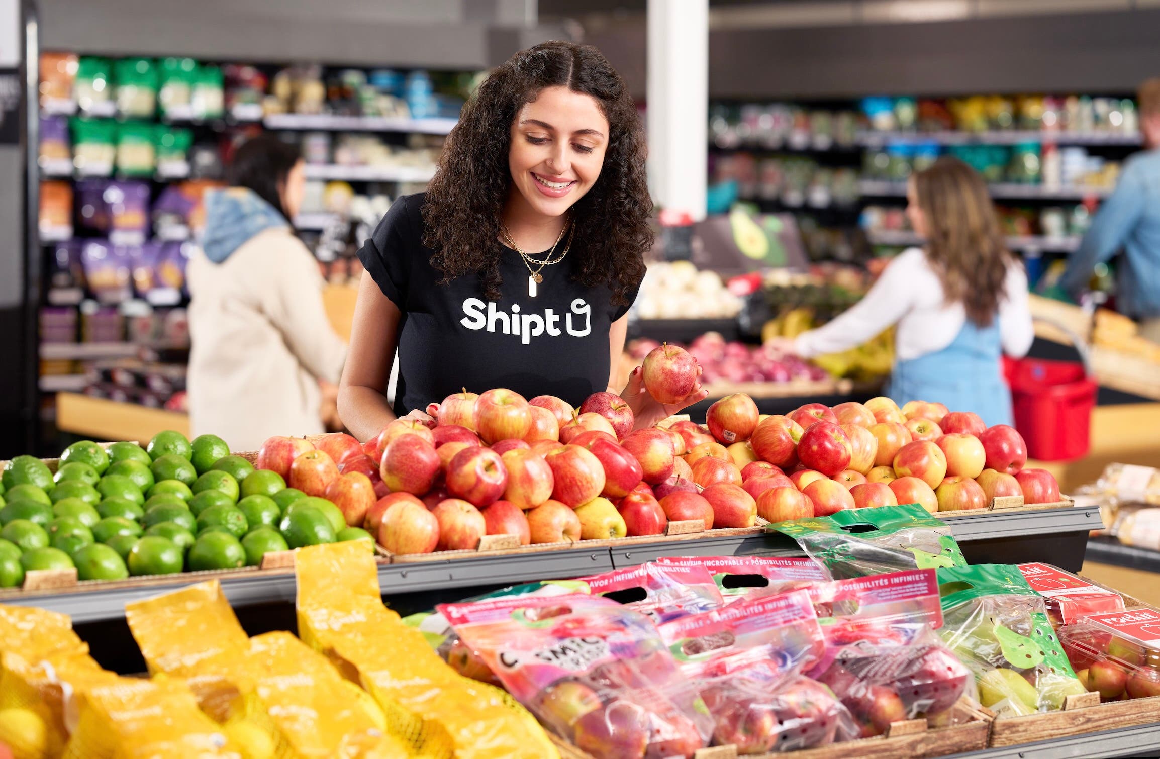 Shopper picking out produce