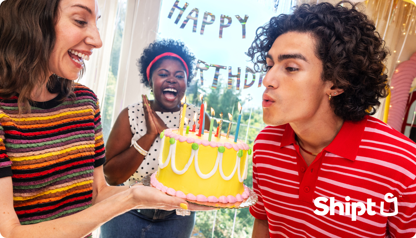 birthday gift card with man blowing out candles on cake