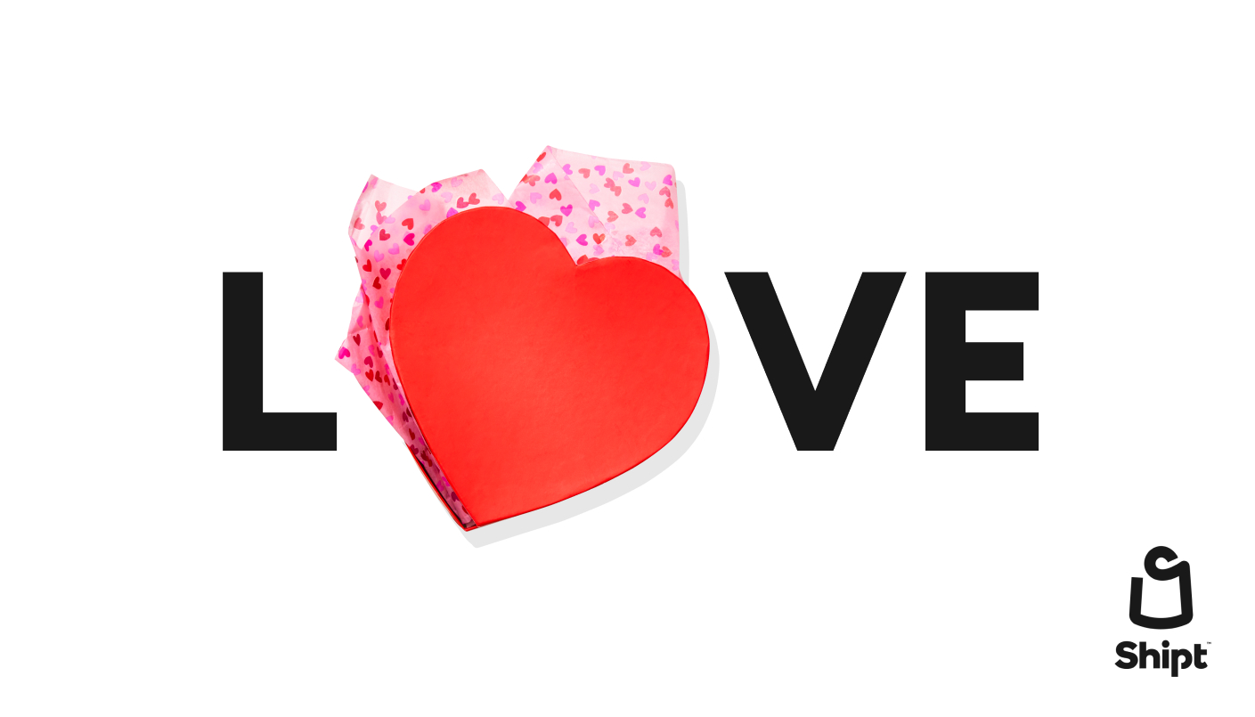 Love written out with heart shaped candy box in place of O