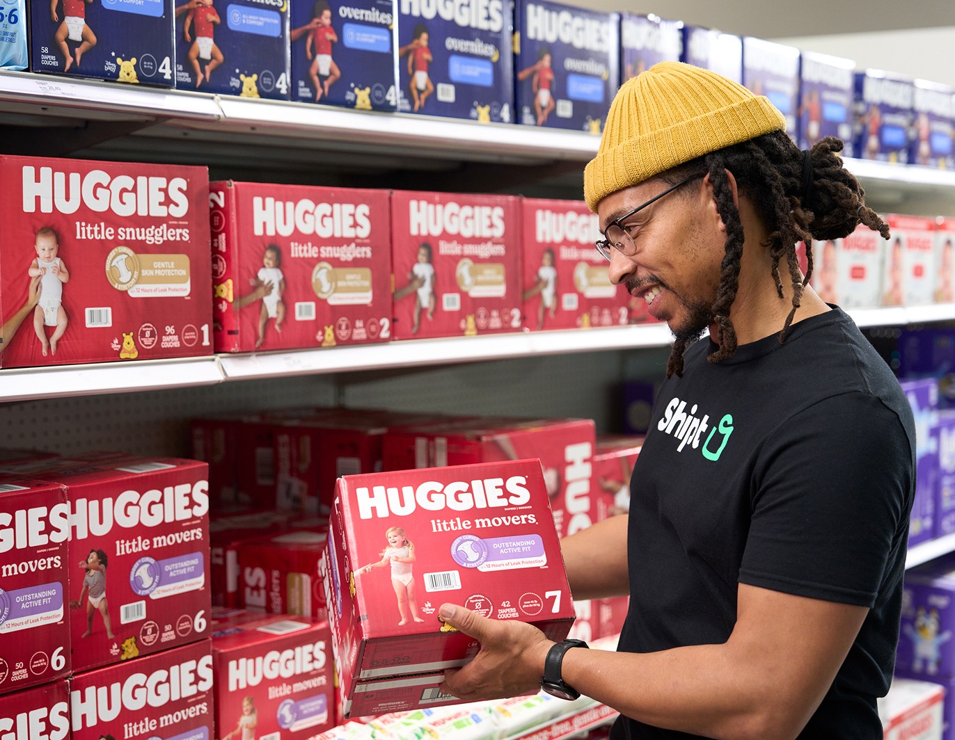 Personal Shopper inspecting product off shelf