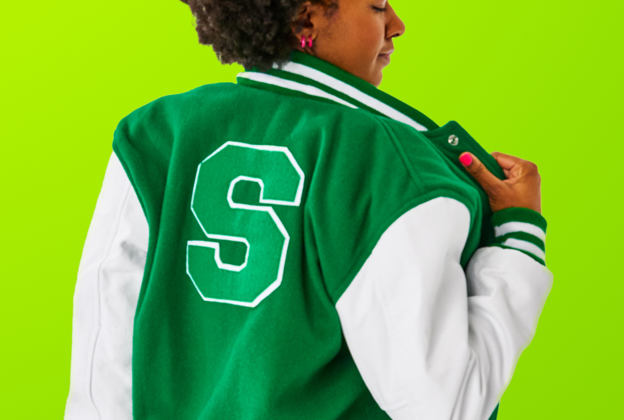 Girl dressed with Varsity green Shipt jacket 