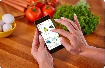 Image of someone using shipt mobile app