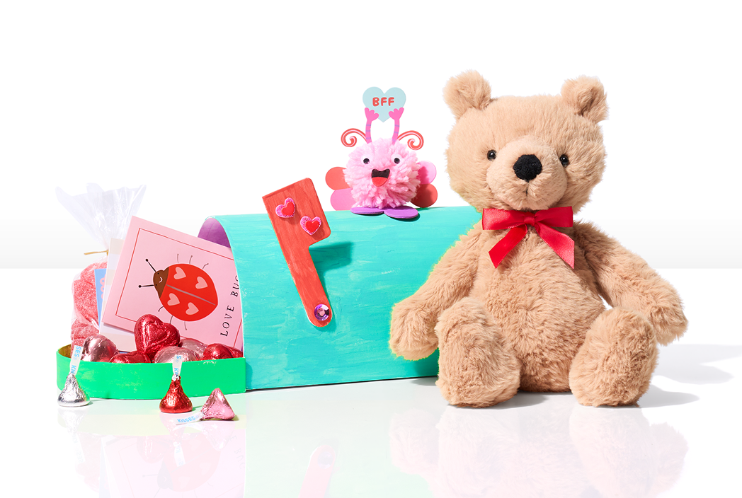 teddy bear with a card and chocolate in a mailbox 