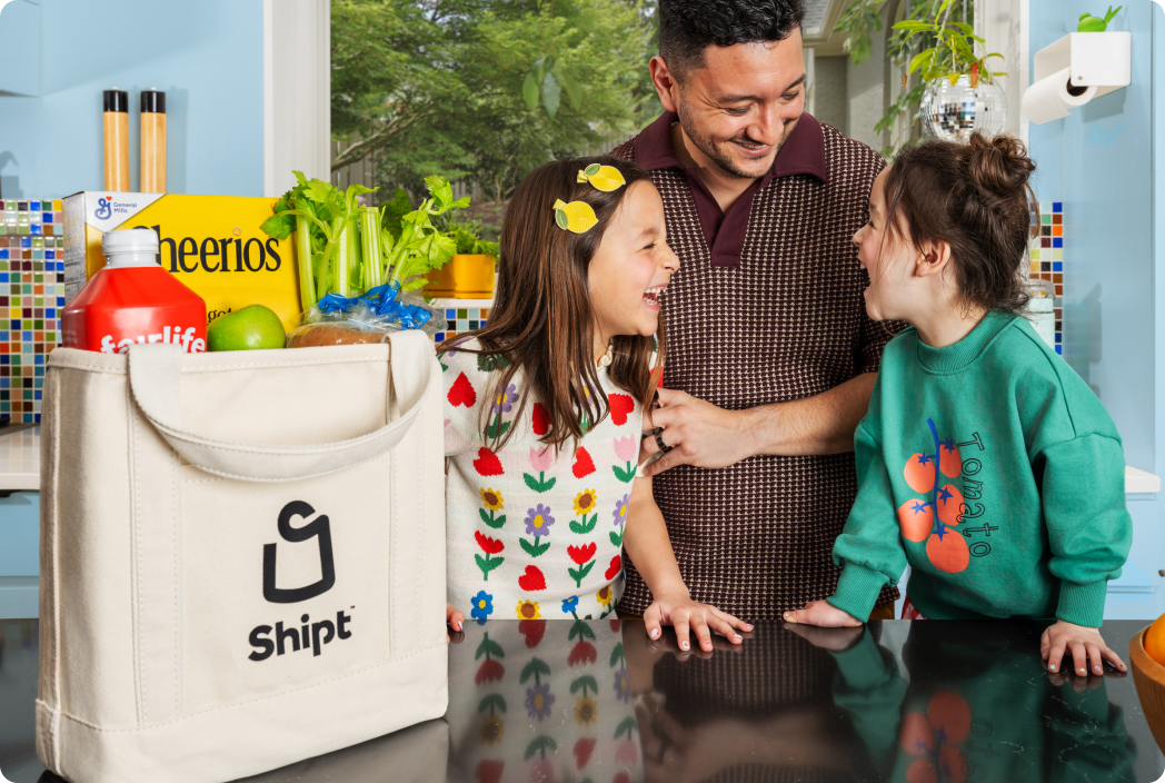 Two bags of Shipt groceries on a doorstep
