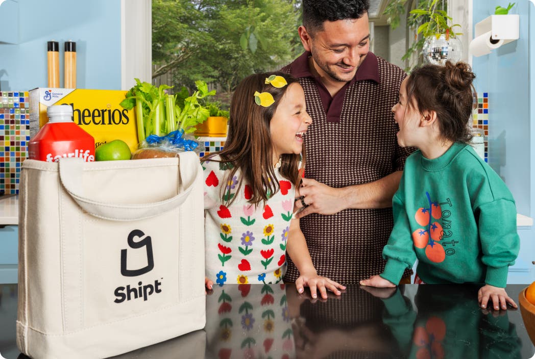 Two bags of Shipt groceries on a doorstep