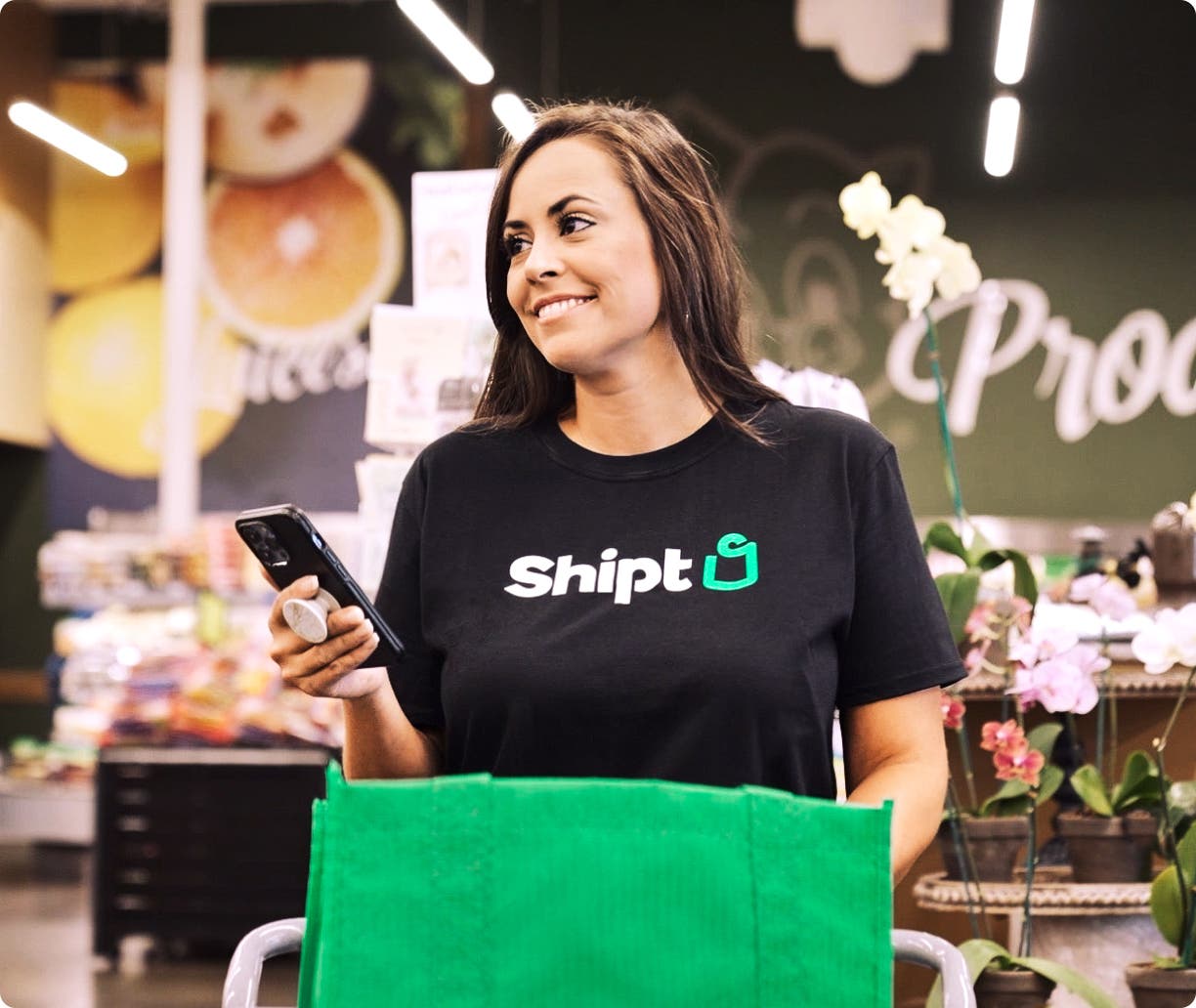 person in green pants jumping with shipt delivery